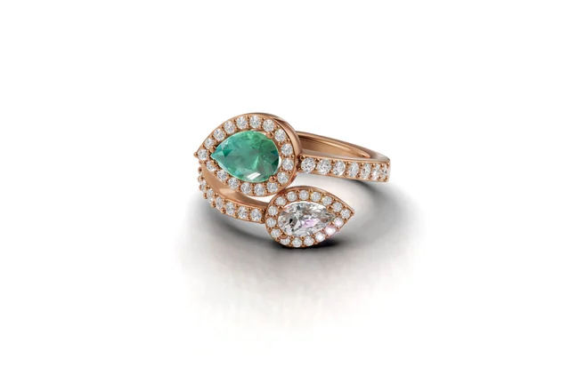 Rendering di anello contrarié con pietre a goccia e montatura color oro rosa